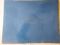 Blue presentation box with Franklin Mint Premiere Portfolio of Celebrity Art insignia.