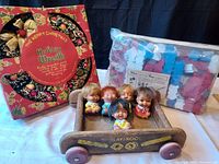 Photo showing all lot items together: bottle brush wreath in original box, wooden Playschool cart with 5 Moody Cutie dolls inside, Lok-A-Blocks set in original packaging.