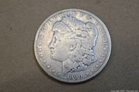 Obverse side of 1890 Morgan Silver Dollar showing Lady Liberty profile and date 1890