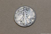 Obverse side of the 1942 Walking Liberty half dollar showing Lady Liberty walking with sun rising and date 1942.