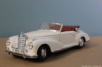 Front 3/4 view of white die cast model showing detailed grille, headlights, and convertible.