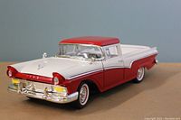 Front and side view of the 1957 Ford Ranchero model showing detailed front grille, red and white paint, and whitewall tires.