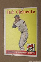 Front of 1958 Roberto Clemente baseball card showing batter pose and Pittsburgh Pirates logo