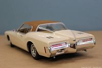 Rear view of the 1/18 scale die cast 1973 Buick Riviera model showing taillights, chrome bumper, and brown roof.