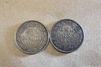 Obverse and reverse of 1896 and 1917 Canadian large cents showing denomination and year 1917 and 1896 with wreath detail.