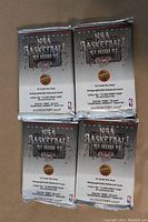 Four sealed foil packs of 1992-93 Upper Deck NBA basketball cards showing the front side of the packs with branding and pack details.