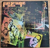 Front cover of Atlantic Rhythm and Blues 1947-1974 Volume 3 double vinyl album featuring colorful abstract musical instrument graphics and images of artists.