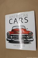 Front cover of 'American Cars' showing a red classic car illustration with glossy dust jacket.