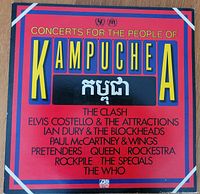 Front cover of double vinyl album with title and artist listing on red and black background.
