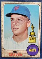 Front of card featuring Tom Seaver portrait with Mets cap, Topps All-Star Rookie trophy graphic, ‘Pitcher Mets’ emblem