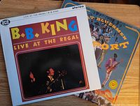 Photo of the two vinyl albums stacked on each other showing the B.B. King 'Live at the Regal' album on top with partial view of the 'Great Bluesmen at Newport' album
