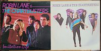 Front covers of two Robin Lane & the Chartbusters vinyl albums, showing band members and album titles 'Imitation Life' and self-titled.