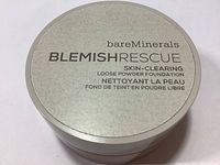Top view of silver lid labeled bareMinerals Blemish Rescue Skin-Clearing Loose Powder Foundation.