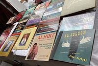 Wide shot showing multiple vintage vinyl record albums arranged in rows, including Glen Miller, Al Jolson, Al Hirt, and others.