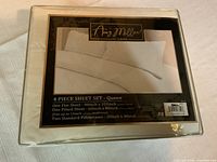 Front view of Amy Miller Home 4 piece queen sheet set packaging showing product details, size, and included pieces.
