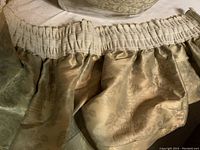 Close-up of curtain panel/topper fabric showing ruched top and floral damask pattern in beige/gold