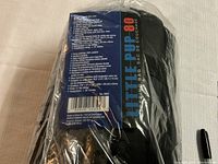 Image showing front label and text of the sleeping bag's carrying sack including product specifications and brand information.