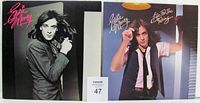 Front view of two Eddie Money vinyl LP records with original picture sleeves. The first album is self-titled and features a black and white portrait of Eddie Money with long hair and a jacket, signature in pink font. The second album is Life For The Taking, showing Eddie Money in a raised fist pose with a vest and white shirt on a color background with warm lighting.