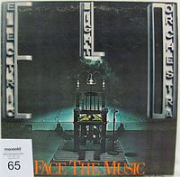 Front cover of Electric Light Orchestra "Face The Music" vinyl LP album showing album artwork and text details.