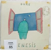 Front cover of Genesis 'Duke' vinyl LP album showing artwork and condition with tape residue on corners.