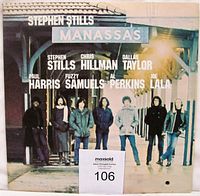 Front cover of Stephen Stills Manassas gatefold vinyl album with band members standing on a train station platform and names above them.
