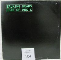 Front of the vinyl album jacket showing the title and band name in green text against black background.