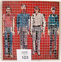 Front cover of the vinyl LP showing four band members behind a white grid on red background.