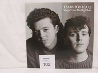 Front cover of the vinyl album showing the black and white photo of the band and album title.