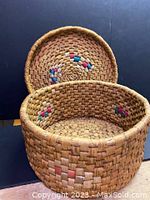 Open view of the hand woven basket showing inside and colored accent pattern