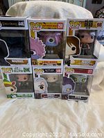 Front view of six boxed Funko Pop figures including Lord of the Rings, One Punch Man, Walking Dead, Elf, The Witcher, and Death Note characters.