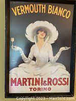 Framed poster showing the full artwork and text 'Vermouth Bianco', Martini & Rossi Torino under a black background.