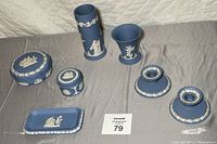 View of all 7 Wedgwood jasperware pieces arranged together showing general condition and style