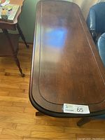 Top view of the wooden sofa table showing the finish and rounded edges on the top