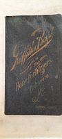 Front cover of a ledger-style booklet, black with gold embossed text from Baltimore Fertilizer Company.