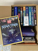 Box with Star Trek books including TV Guide Official Collector's Edition 30 Years, Star Trek Federation, Probe, Mosaic, and Reunion among others.