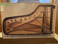 Full view of the framed Steinway piano interior diagram picture with text 'Steinway, The Standard Piano of the World'.