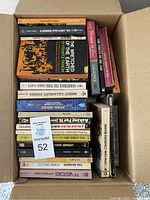 Overview photo showing the full box of used vintage books stacked vertically and filling the box.