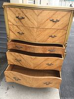 Front view of dresser with some drawers opened