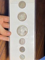 Front side of the Canadian 1963 silver coin set in the original plastic sleeve showing coins and year set label