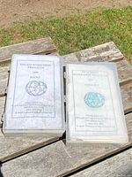 Two plastic cases containing geological kits on a wooden surface outdoors. Each case has a cover sheet displaying 'Edgeo Workshop Program' 2008.