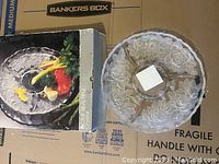Full view of the vintage crystal chip and dip serving platter alongside original box showing floral etched design and divided sections.