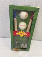 Boxed Hallmark Baseball BBQ Utensil Set showing two baseball bat utensils and two baseball-shaped shakers through clear window, box front view.