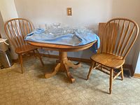 Overview of wood table and chairs with crystal display