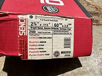Close-up of box label showing nail specifications, quantity, and compatible nailers.