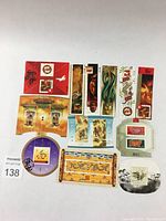 Full lot of 12 Canadian Chinese New Year souvenir sheets and singles laid out on white background for overview.