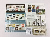 Photo showing all six Canadian animal souvenir stamp sheets arranged on a flat surface with various animals depicted, including birds, reptiles, and mammals. Sheets show postmarks indicating they are used.