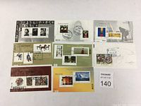 Set of 7 Canadian artist-themed souvenir stamp sheets displayed flat showing artists and stamps