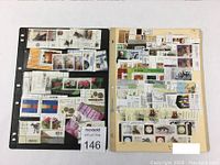 Two stamp holders with mixed used Canadian stamp blocks including flowers, flags, and portraits on cream and black mount pages.