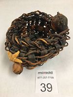Front angle of bull kelp basket with natural bulbous kelp pieces and star-shaped kelp decoration visible