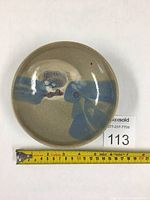 Top view showing glaze colors and texture under light.